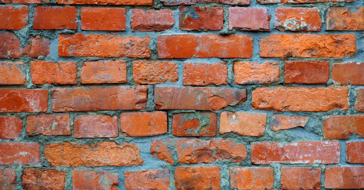 High-resolution image showcasing a textured brick wall, ideal for urban and construction themes.