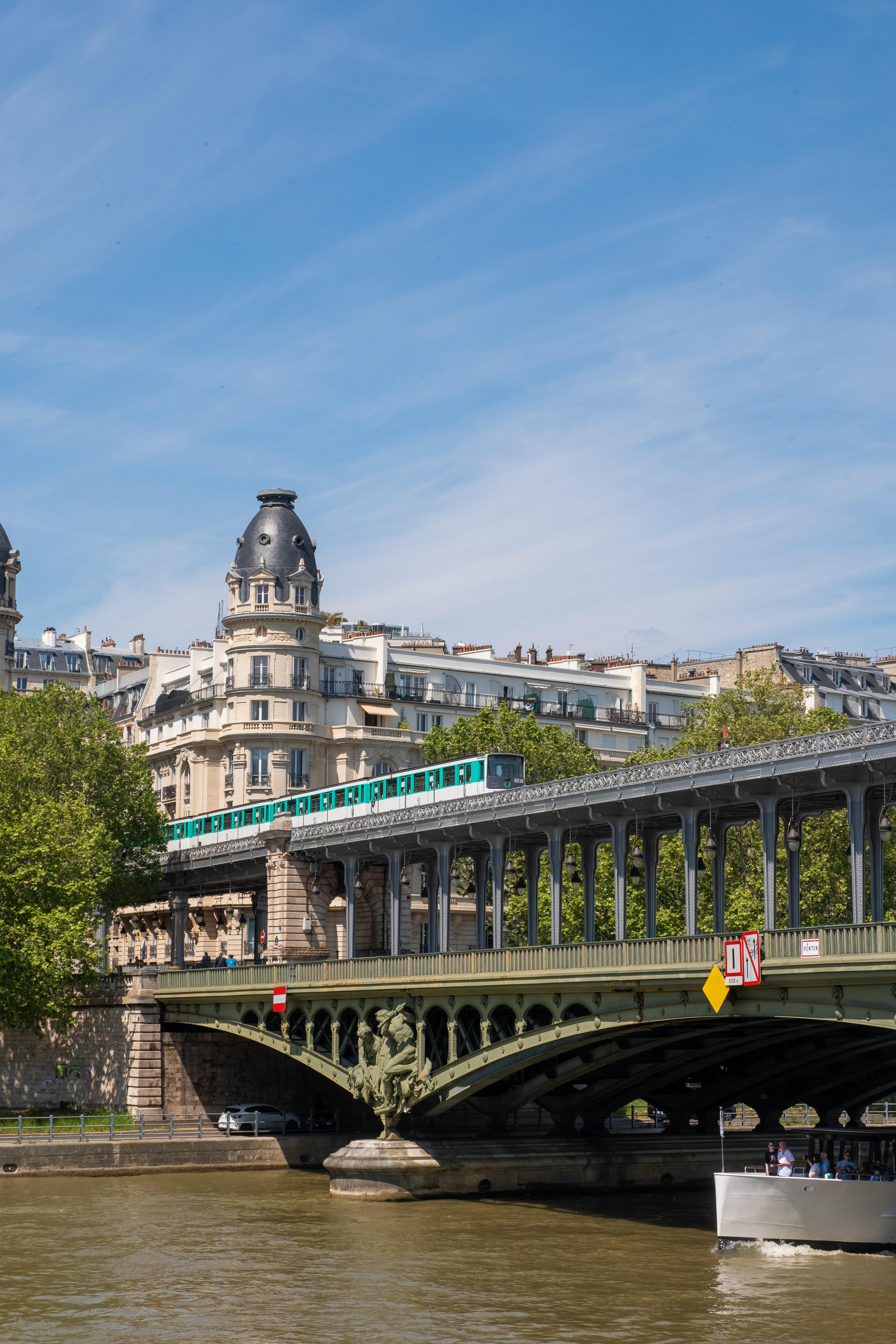 a subway train crossing pont de bir hakeim over seine river in paris france