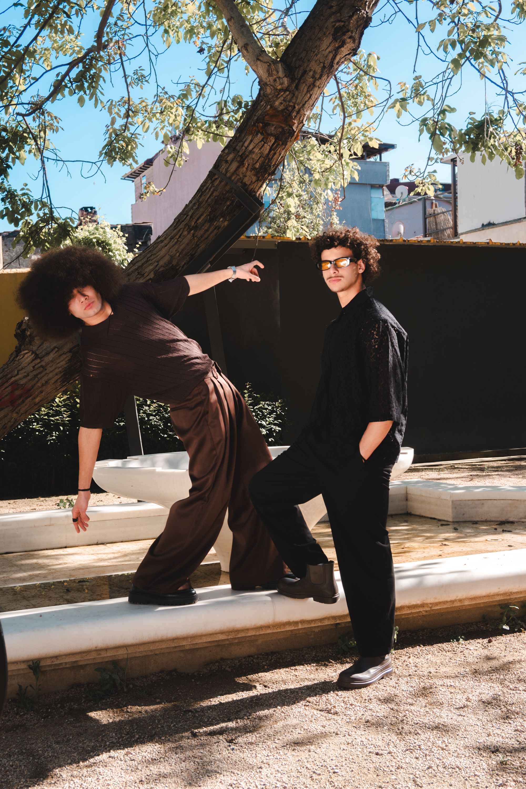 Two Fashionable Men Posing in a Park · Free Stock Photo