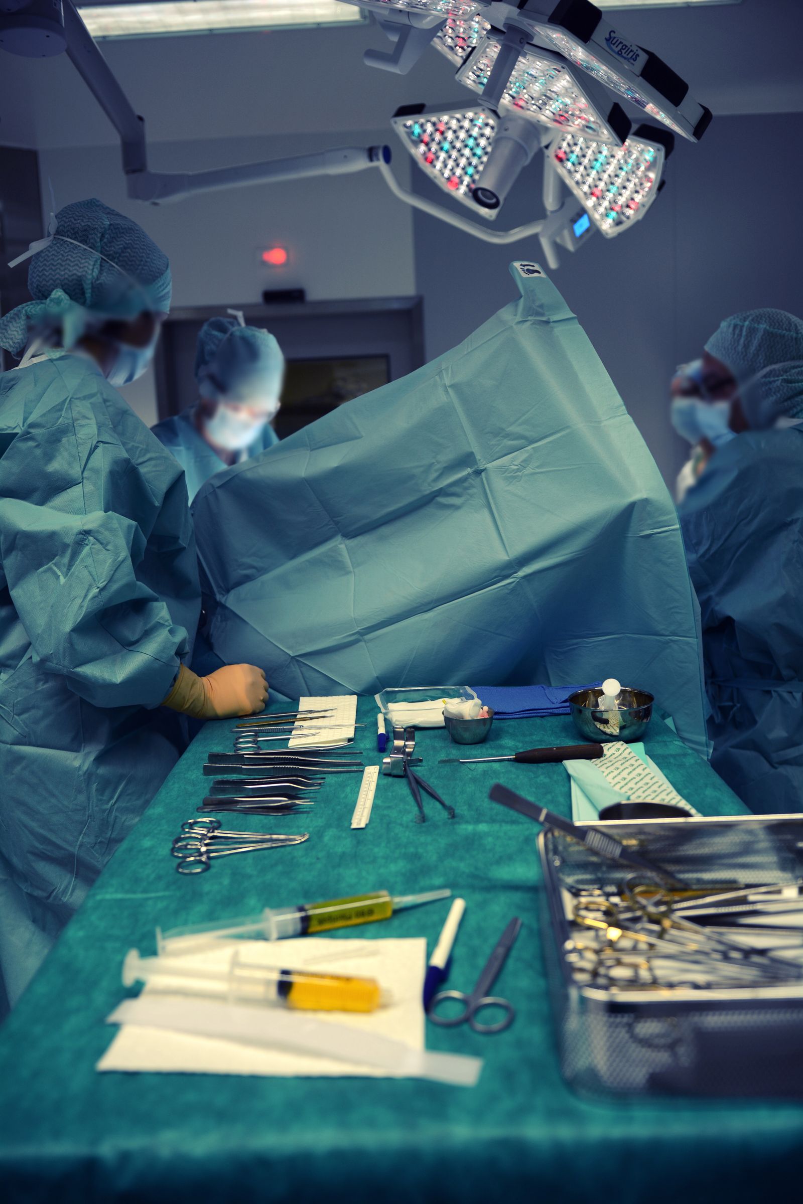 Surgical instruments laid out on a table in an operating room
