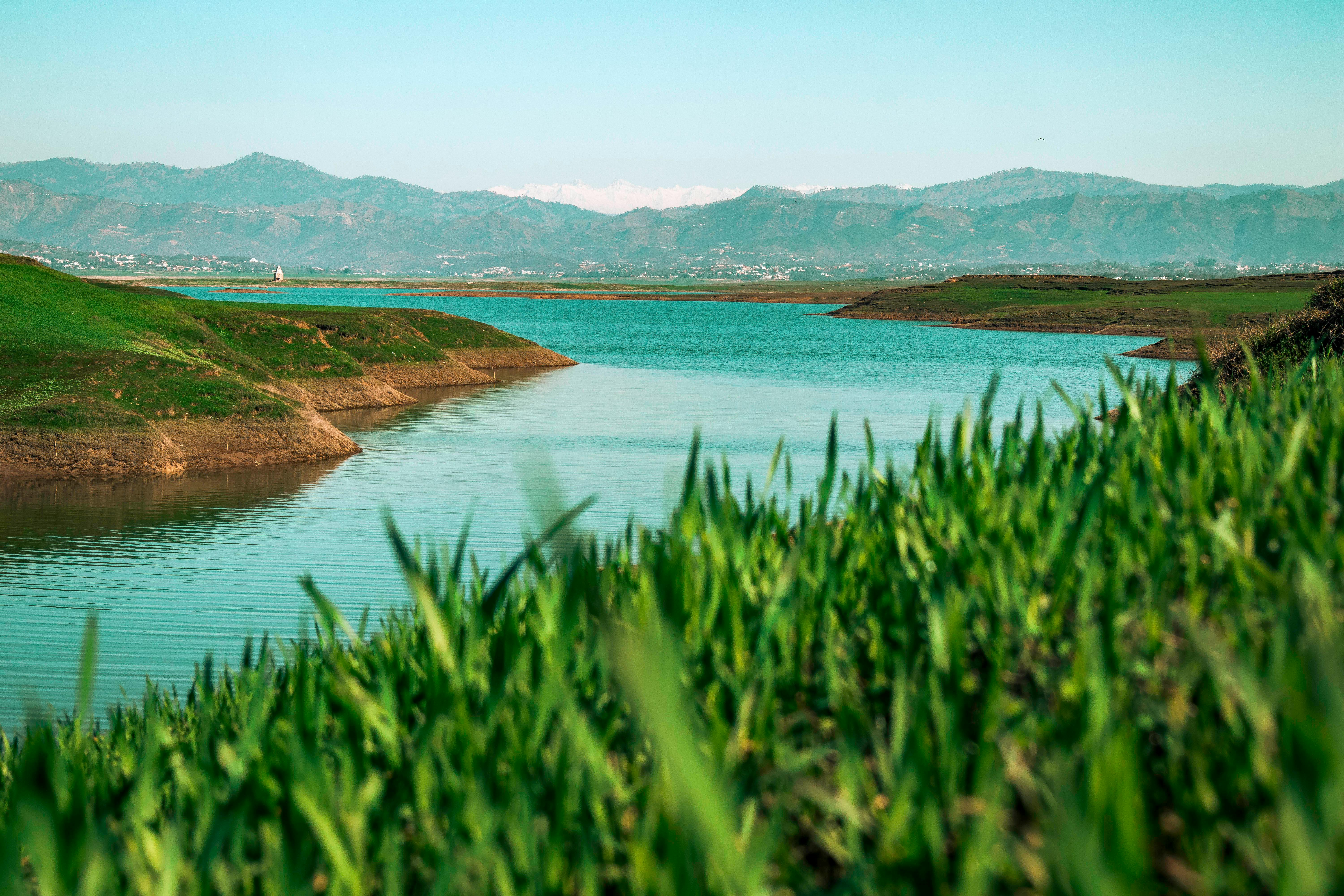 scenic view of a river and distant mountains