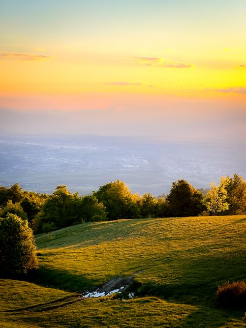 Free Breathtaking view of lush hills at sunset with a tranquil atmosphere. Stock Photo