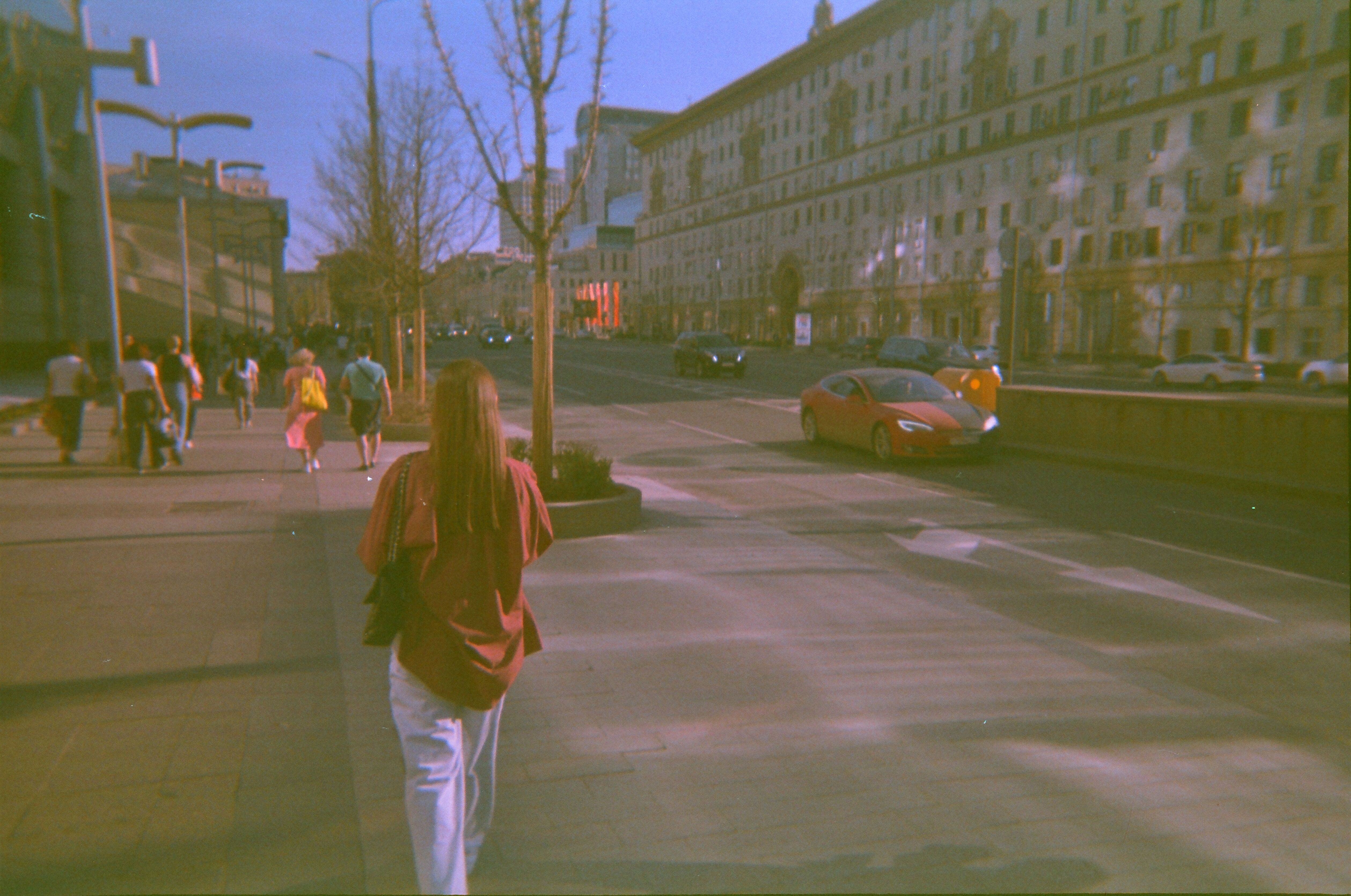 Woman striding confidently down a city street