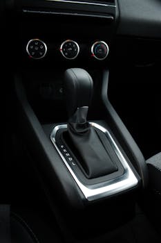 Detailed view of a modern car's gear shift panel and interiors.