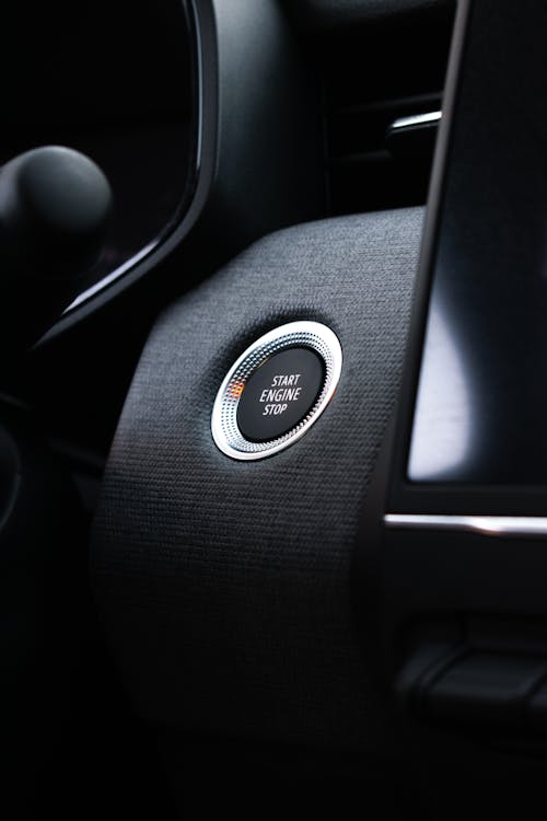 A close up of the button on the steering wheel of a car