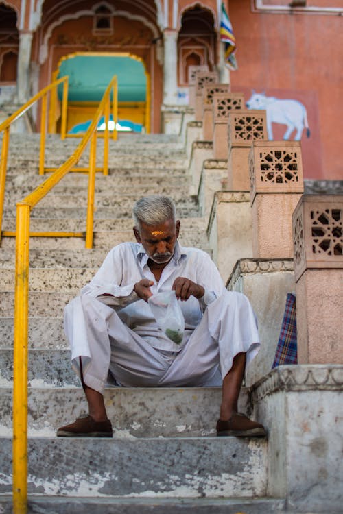 Man Sitting On Stairs