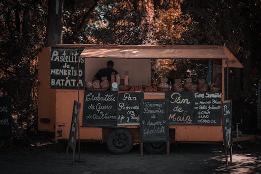 A nostalgic street food stall selling assorted breads in an autumn setting.