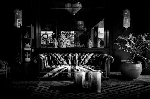 Black and white photo of a living room with a couch