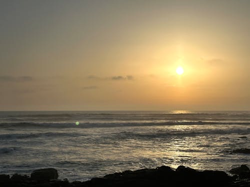 Sunset over the waves of the Atlantic Ocean near Camposancos, A Guarda, Galicia, Spain, April 2023