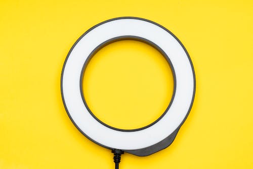 A ring light on a yellow background