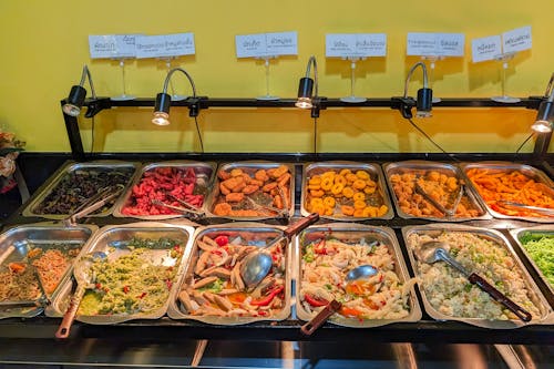 A buffet of food is displayed on a counter