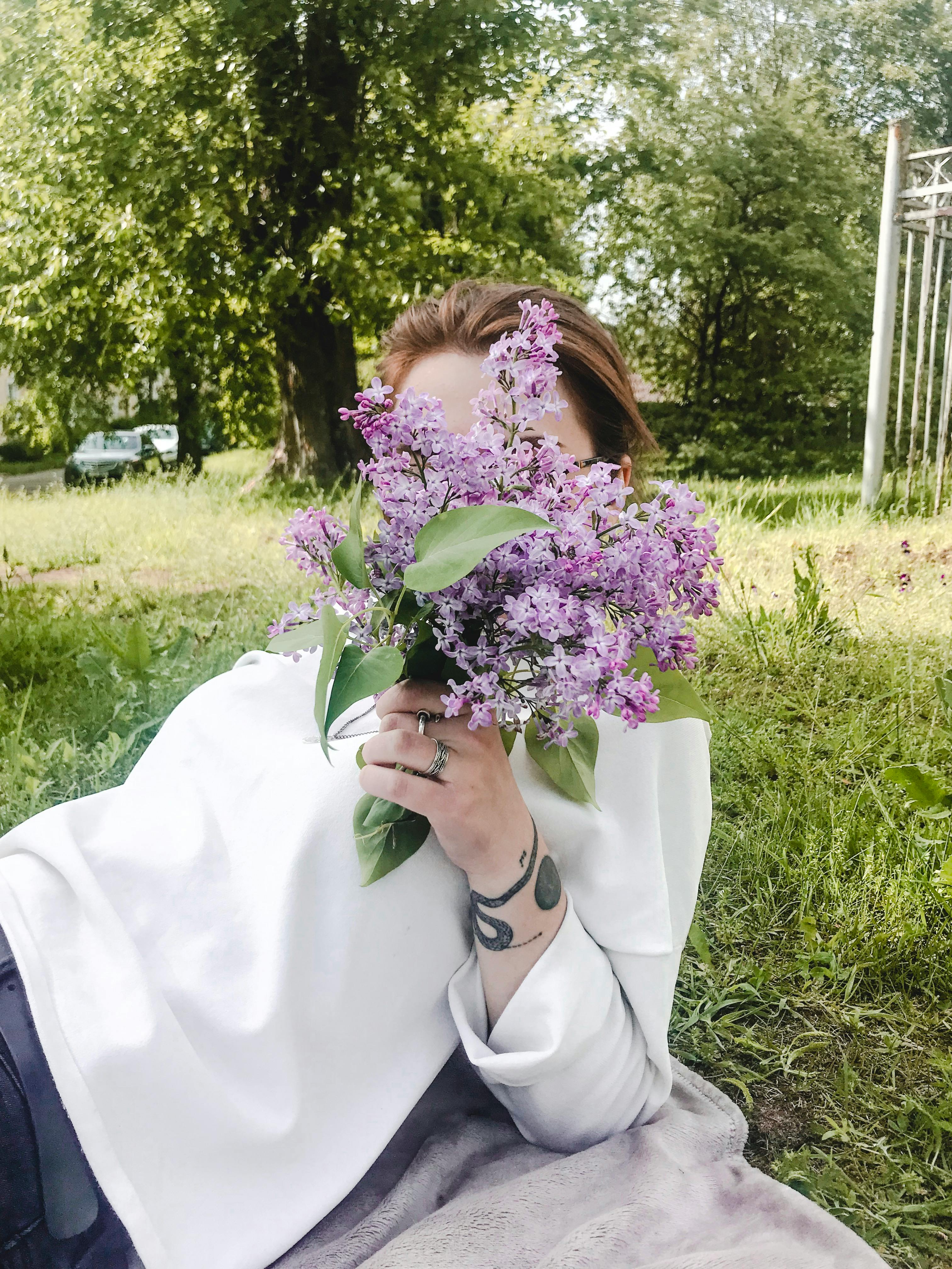 Woman Holding Flowers · Free Stock Photo