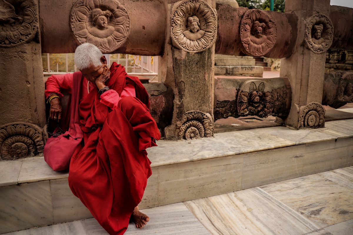 Elderly monk in red robes