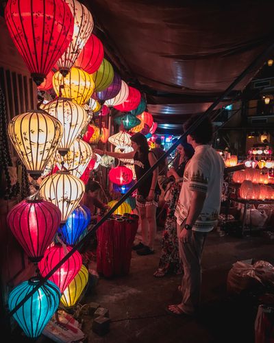 Lantern-lit night market street — Alfie Thompson on Pexels