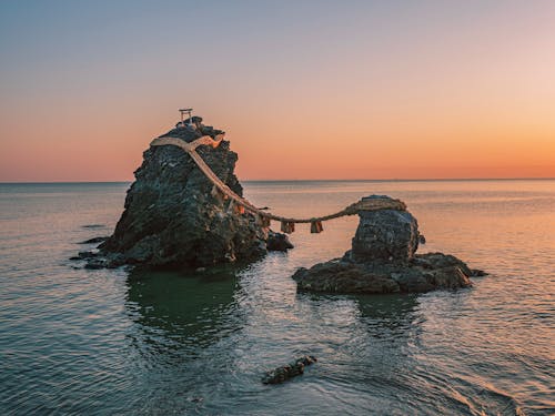 Rock Formations On A Body Of Water