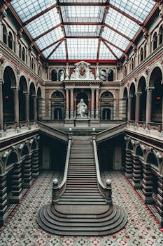 Majestic view of the Palace of Justice in Vienna, showcasing neoclassical architecture. by Josh Hild