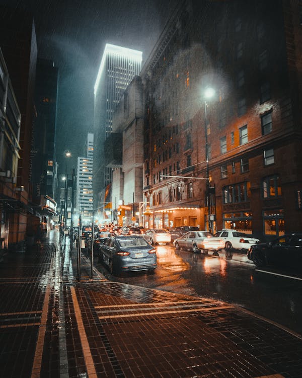 Photo of Vehicles on Road While Raining