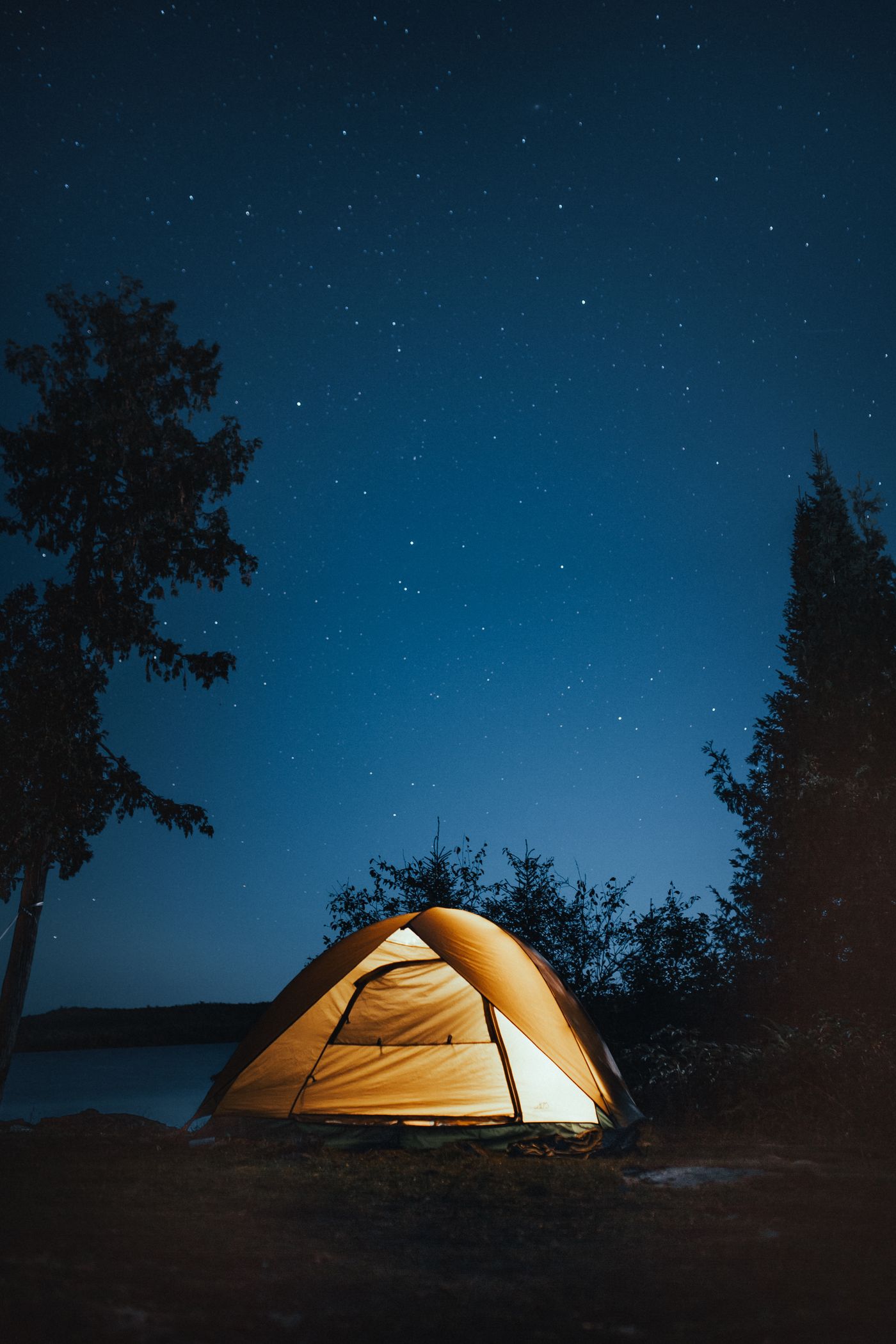 Camping equipment arranged for an outdoor overnight experience