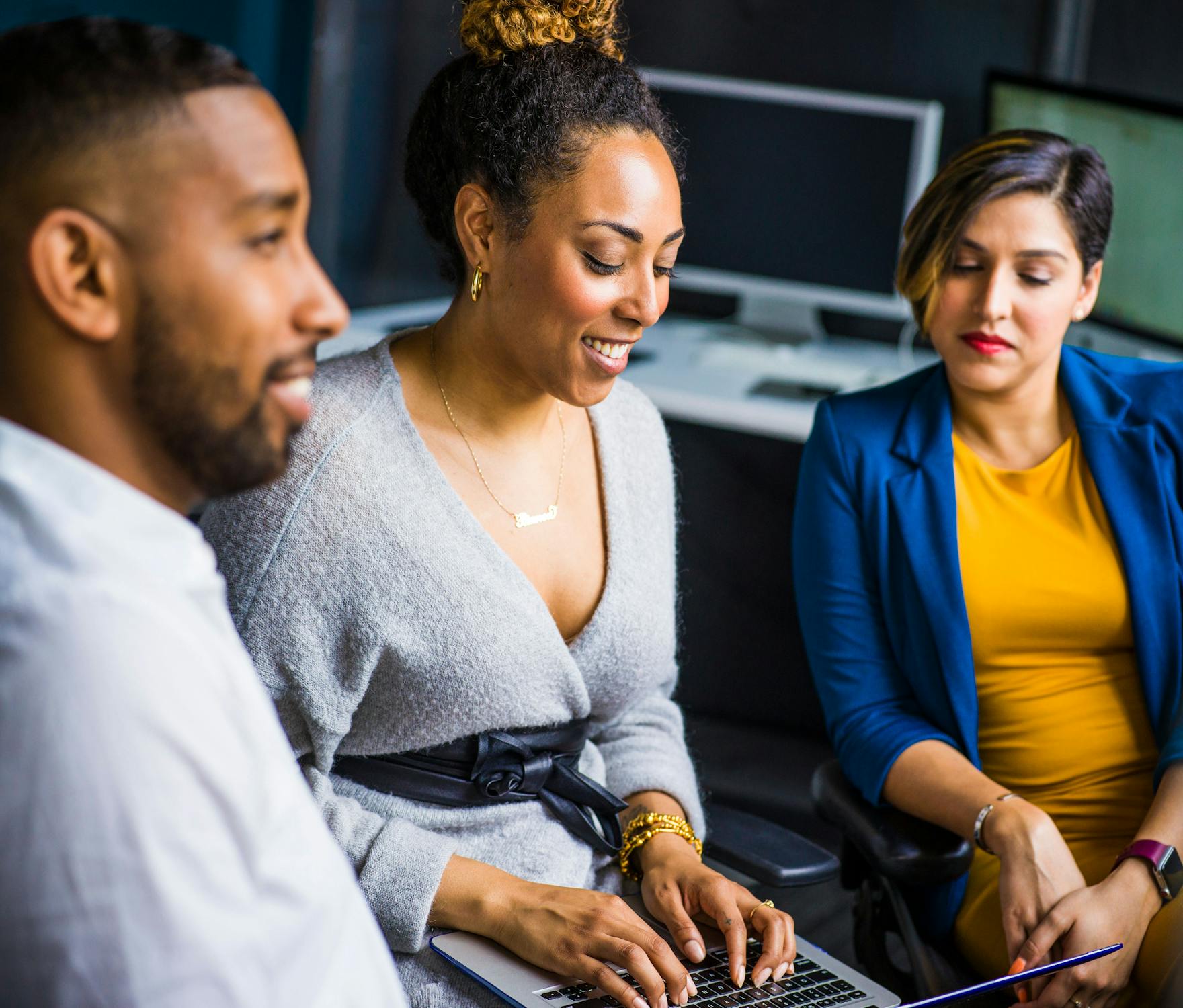 Group of workers using laptop