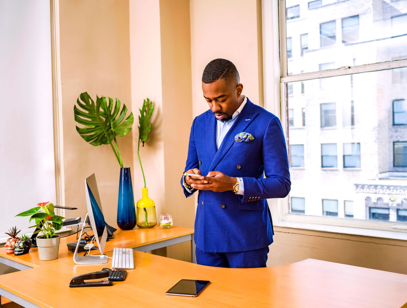 Business professional using a smartphone in a modern office