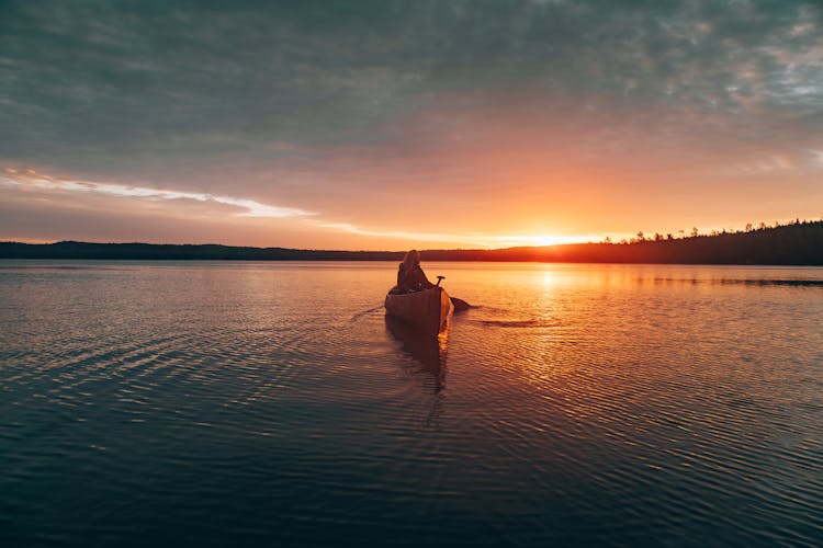 Photo Of Person Riding Kayak