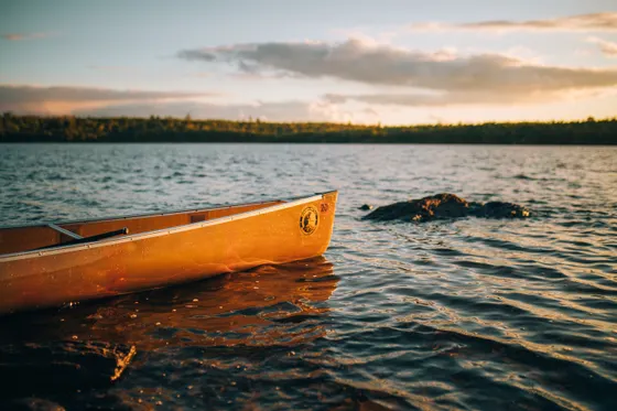 A canoe on a calm Boundary Waters lake