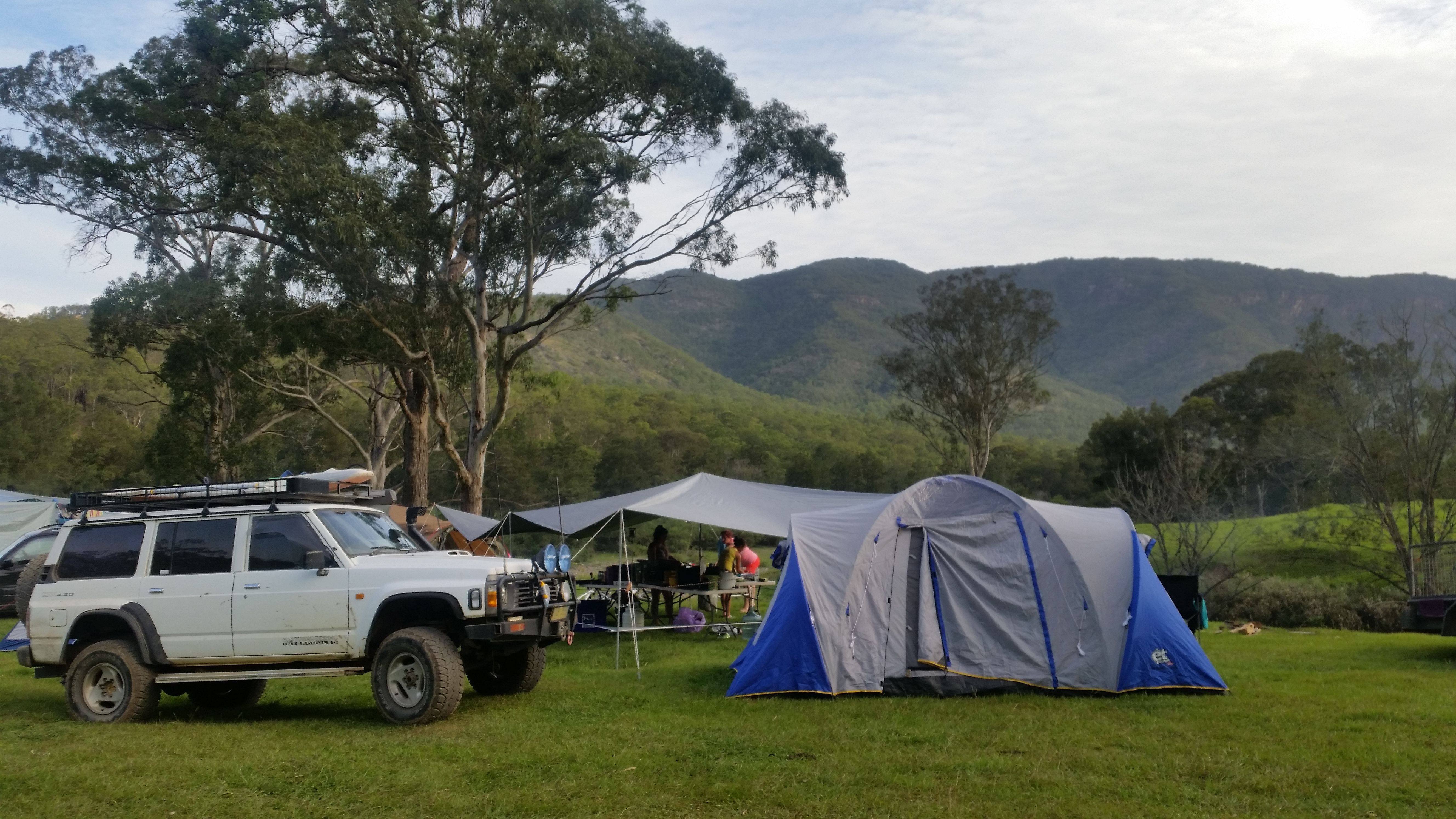 4WD adventure vehicle parked for wilderness camping with outdoor expedition gear setup