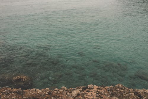 Rock Formation Near Body of Water