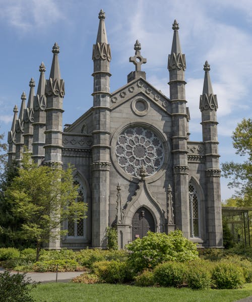 A large stone church with two towers and spires