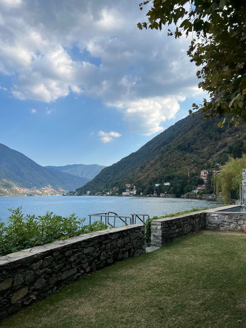 Free Breathtaking view of a serene lake with hills in Italy, ideal for travel inspiration. Stock Photo