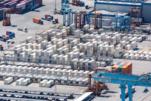 An aerial view of a container yard with many containers