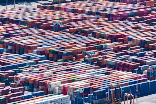 A large container ship is filled with many different colored containers