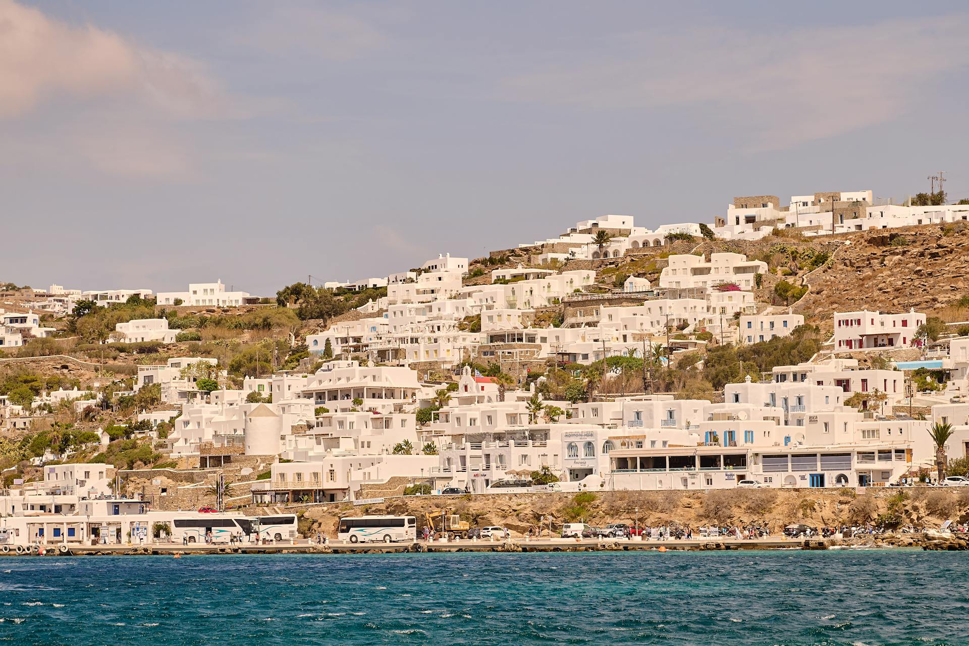 Breathtaking view of iconic whitewashed buildings on Mykonos Island, Greece coast.