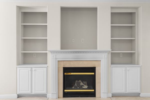 Elegant white fireplace mantel in a finished living room