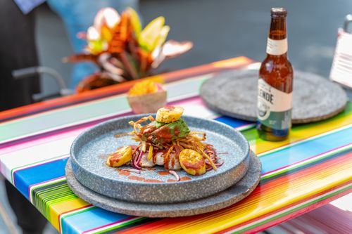 Free Delicious Mexican cuisine served with beer on a vibrant table setting in Mexico City. Stock Photo
