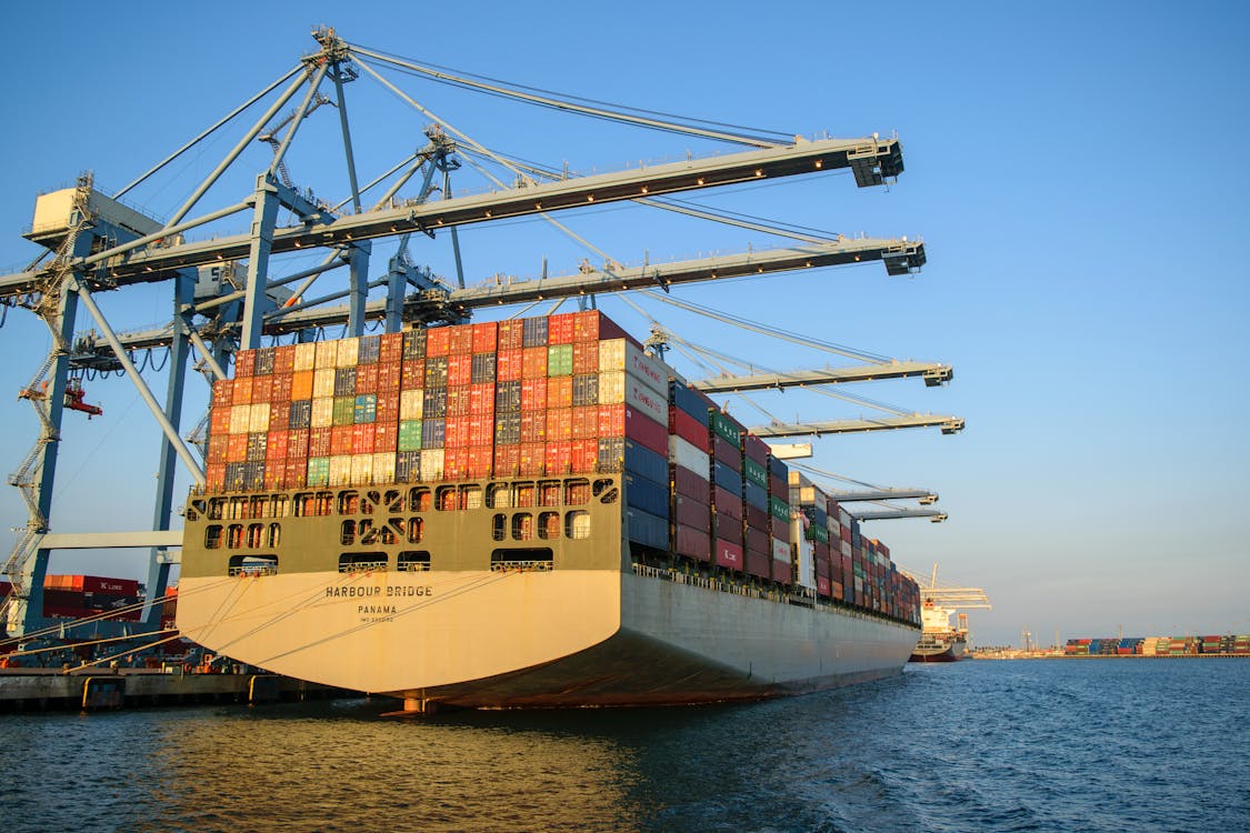 A container ship is docked at a port