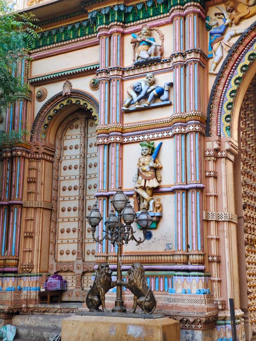 A colorful building with ornate carvings and statues