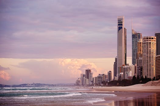 Skyline of Surfers Paradise at sunrise with skyscrapers overlooking the beach in Gold Coast, Australia.
