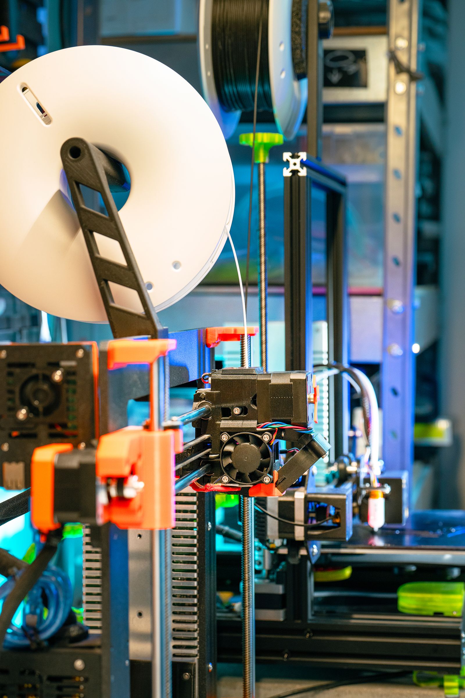 Modern 3D printer in a workshop setting