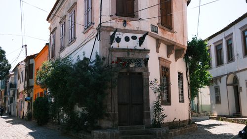 Free Explore the quaint streets and historic buildings of Ayvalik, Turkey, basking in sunlight. Stock Photo