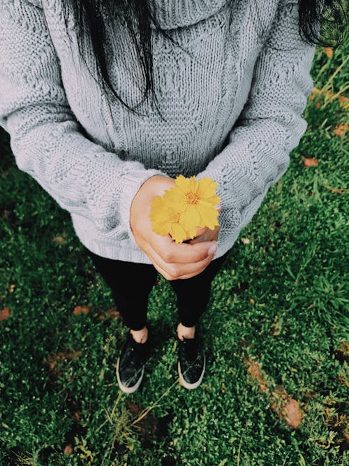 Woman Holding Yellow Flower