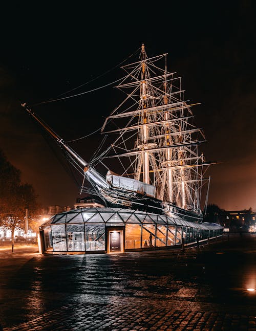 Brown Galleon Ship Themed Building during Nighttime