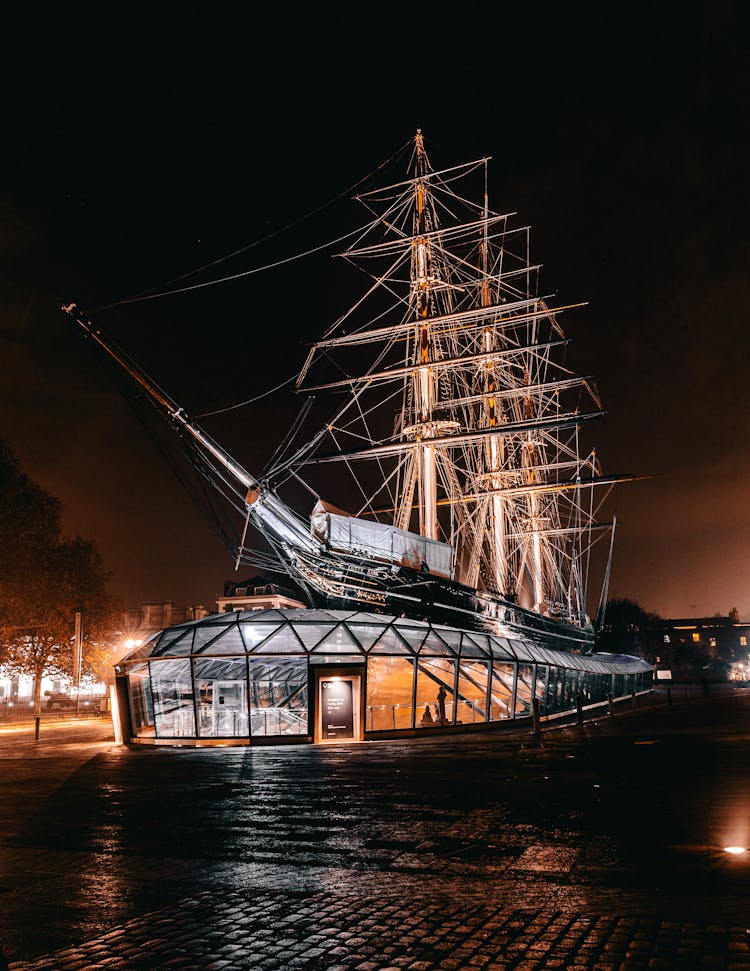 Brown Galleon Ship Themed Building During Nighttime