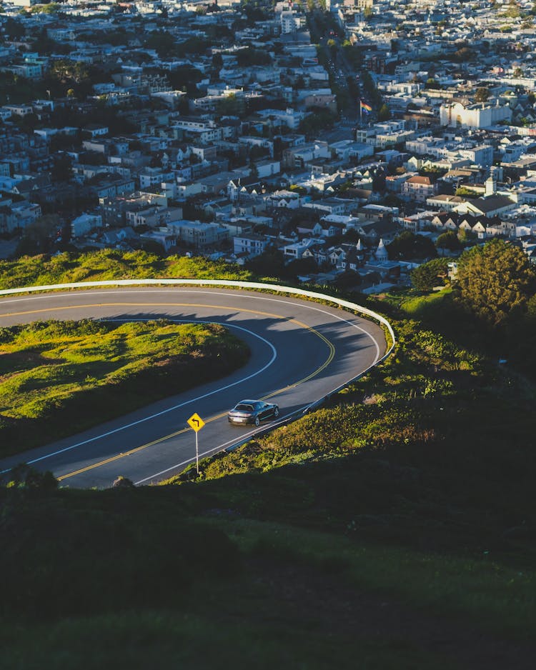 Asphalt Road And Cityscape On Sunny Day