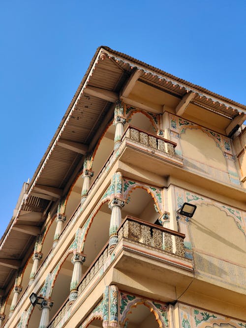 The facade of a building with ornate balconies