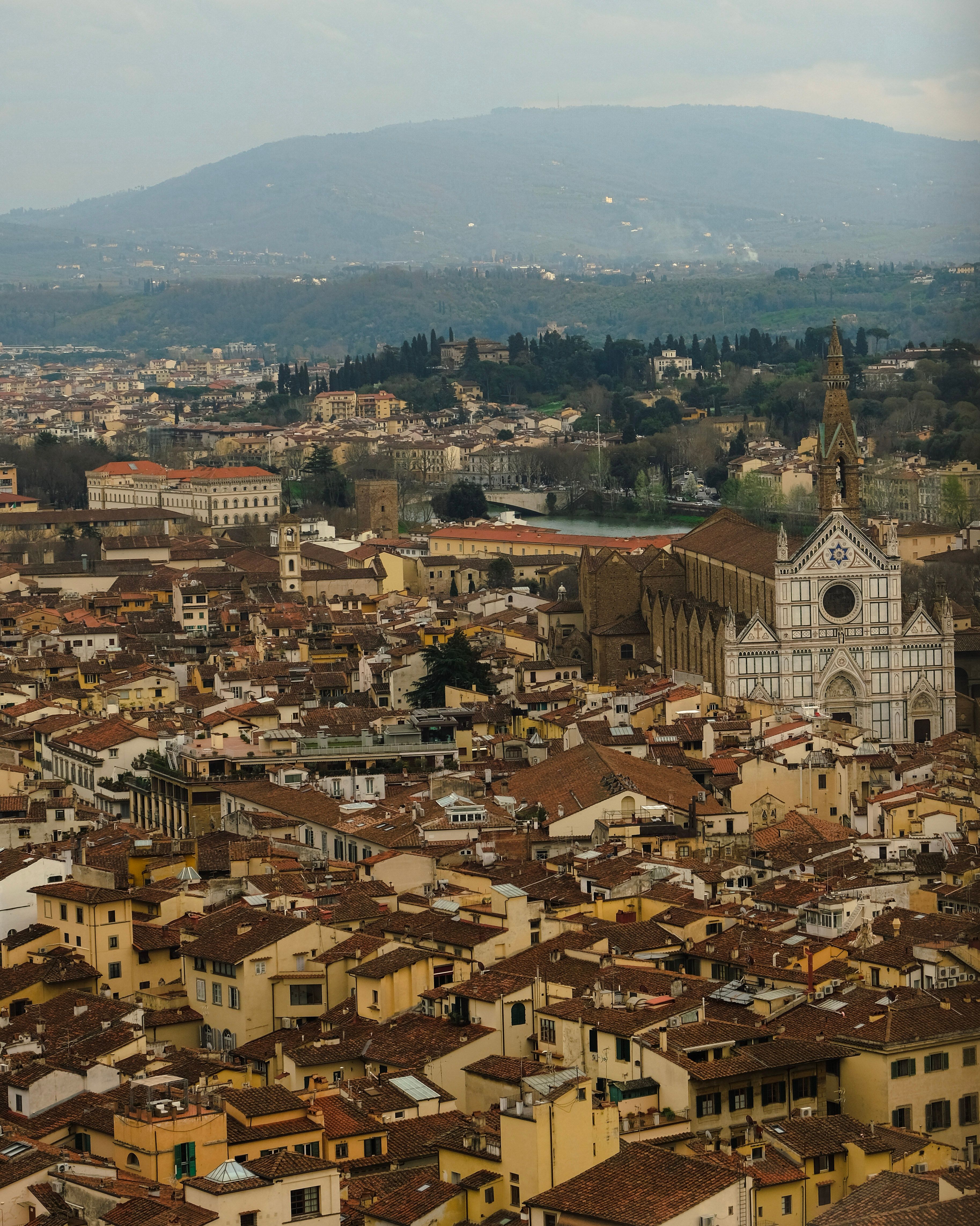 Explore the rich architectural heritage of Florence from an aerial perspective, highlighting its iconic landmarks.
