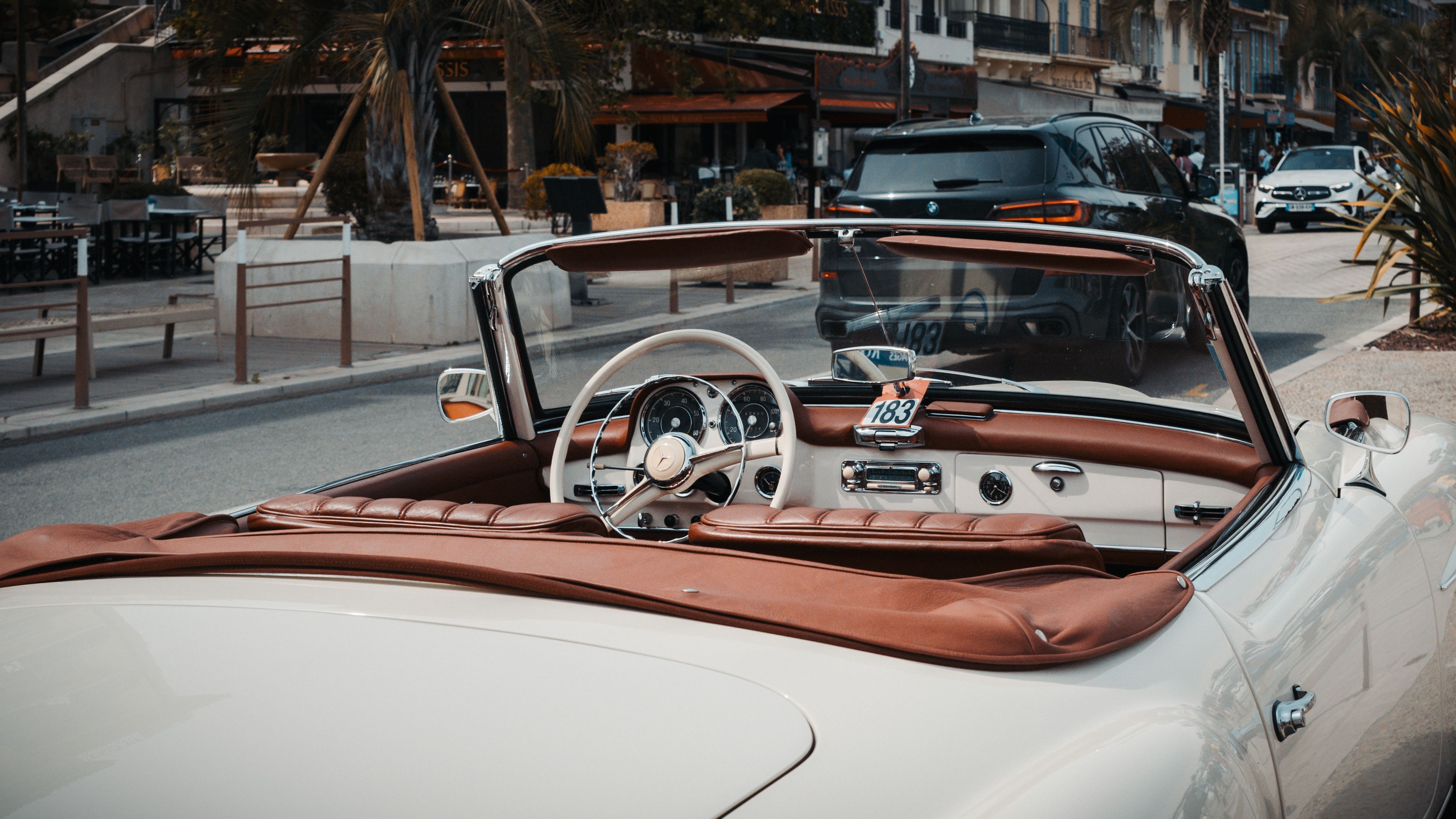 Vintage Convertible Car on Sunny Street · Free Stock Photo