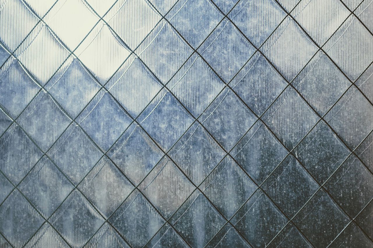 close up of a textured metal surface with geometric patterns captured