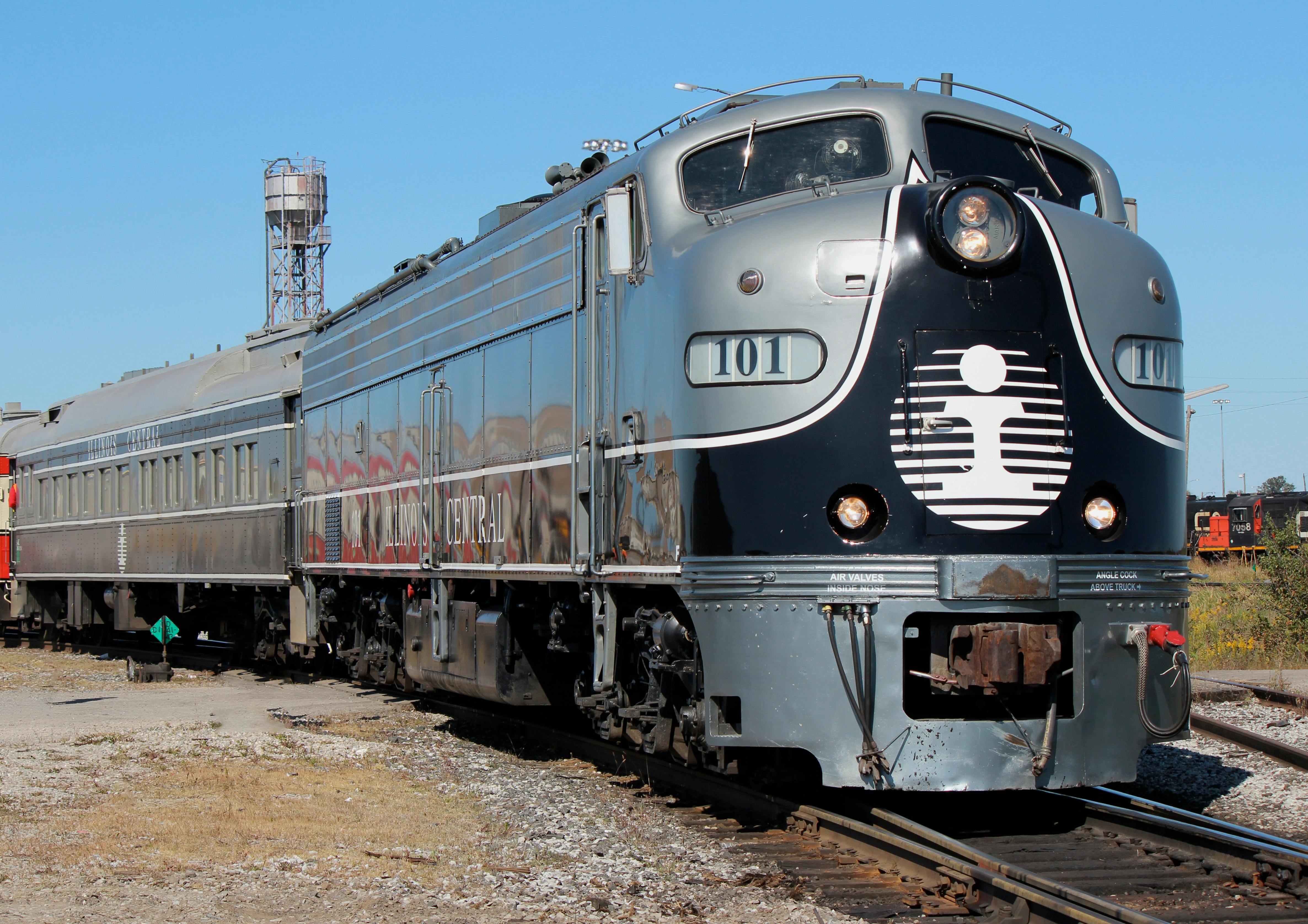 silver locomotive on railway