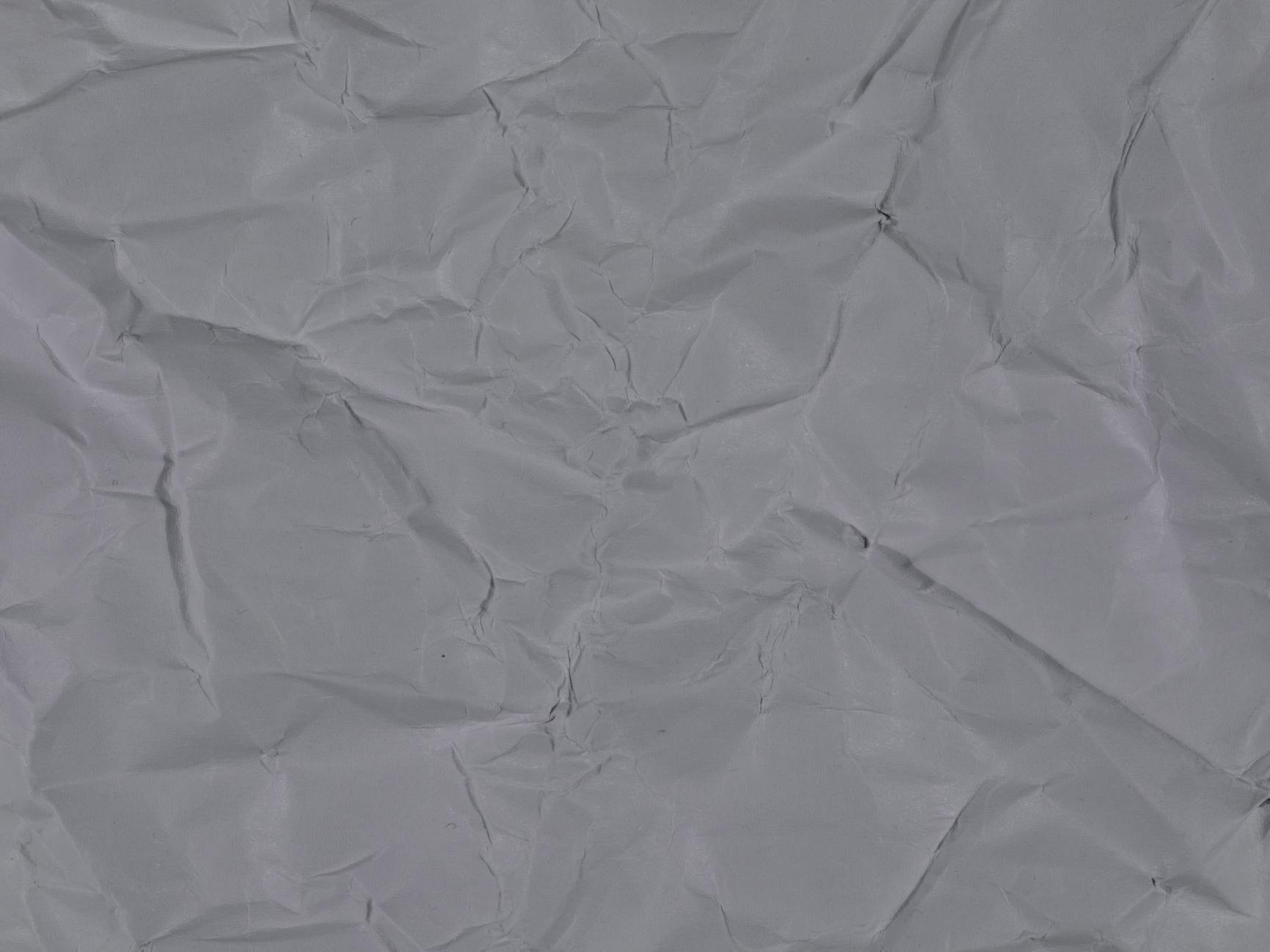 High resolution wrinkled white paper texture for design and creative projects.